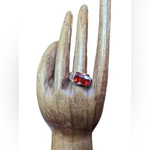 Sterling silver ring with barrel cut orange stone